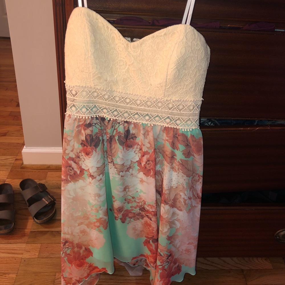 A colorful strapless sun dress.